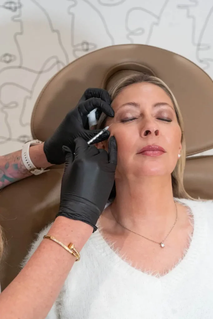 A woman is receiving Xeomin treatment in Cedar Park, TX at C2 Aesthetics